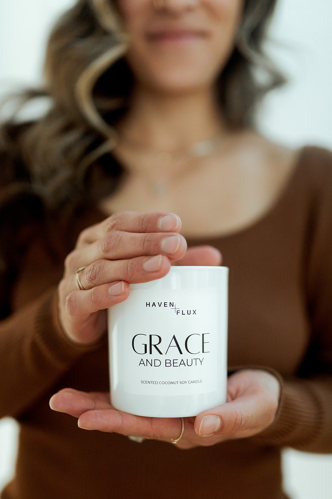 Grace Wooden Wick Candle featuring a luxurious blend of orange blossoms, dewy gardenia, and spiced vanilla scent notes. Crafted with high-quality, non-toxic ingredients, this candle embodies the essence of beauty and grace in its various forms, from delicate blooms to warm spices.